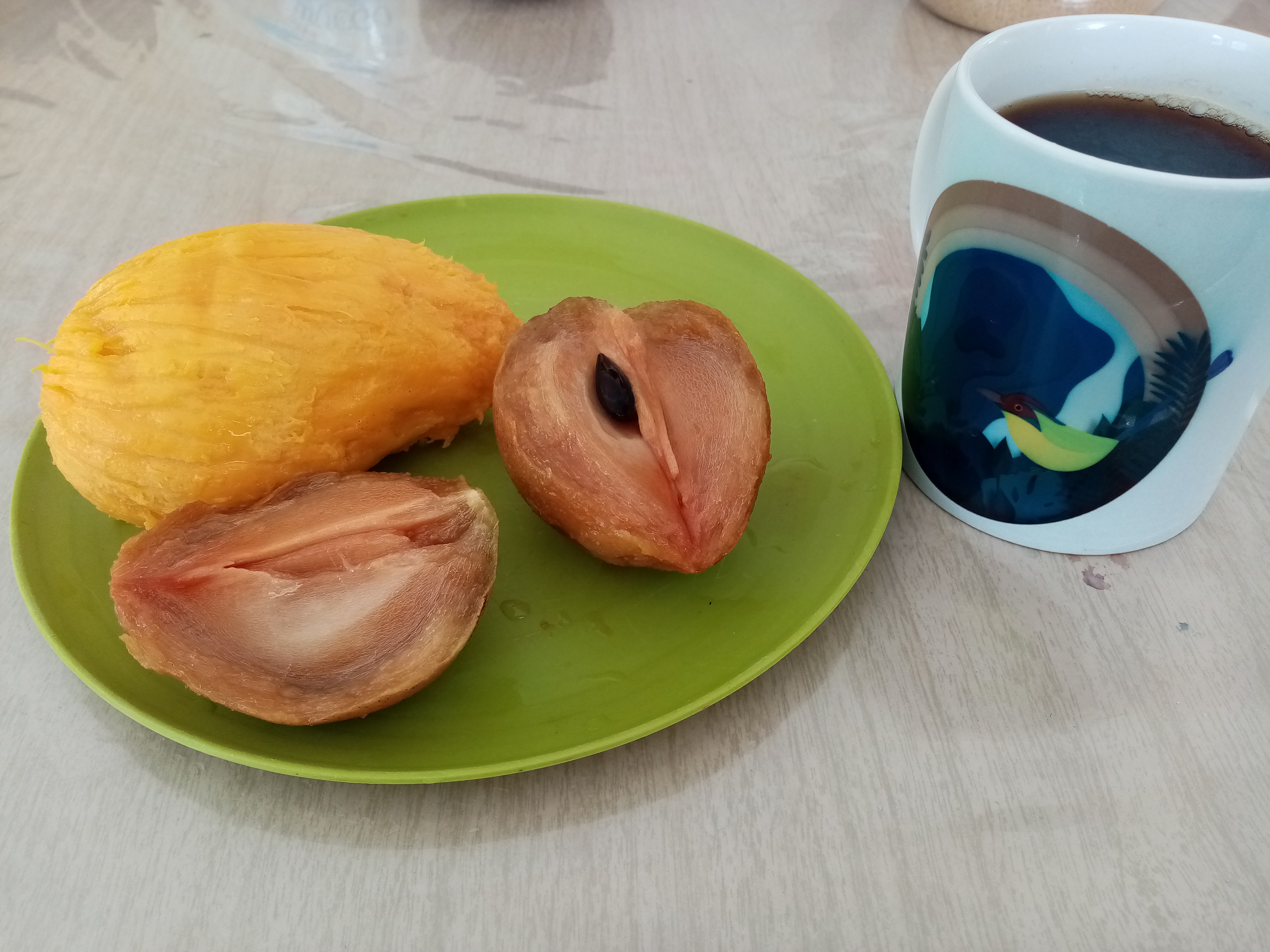 Fruit and a mug of coffee