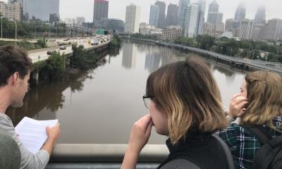 Liquid Histories and Floating Archives students looking out towards the Schuylkill from the South Street bridge